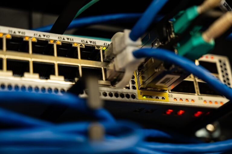 Ethernet cables plugged into the front of a multi-port network switch — featured image for our budget 2.5GbE switch buyer guide