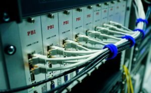 Managed network switch and Ethernet cables in a home lab rack