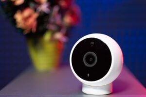 Close-up of a modern security camera representing Frigate NVR object detection powered by Coral alternatives like Hailo and Intel Arc