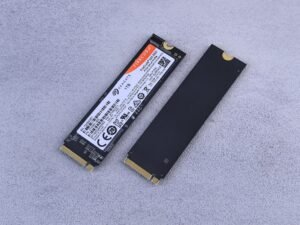 Two NVMe SSDs on a gray background — illustration for best budget NVMe SSD Proxmox picks