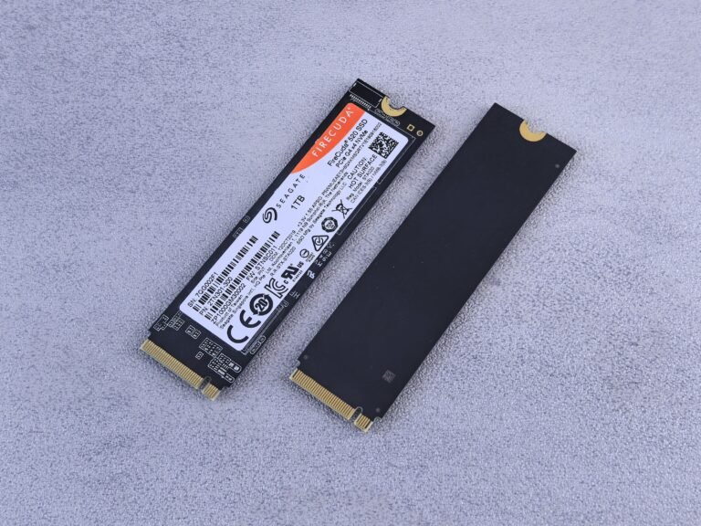 Two NVMe SSDs on a gray background — illustration for best budget NVMe SSD Proxmox picks
