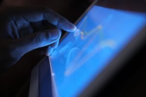 Hand interacting with a touch-screen tablet — a wall-mounted tablet makes a great Home Assistant dashboard